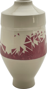 a white vase with a red design on it